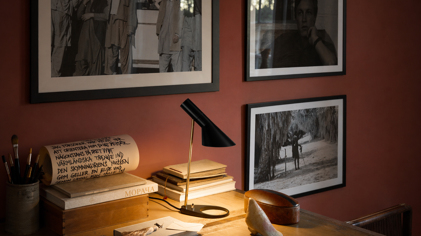 Desk lamp from Louis Poulsen Collection lighting a work table