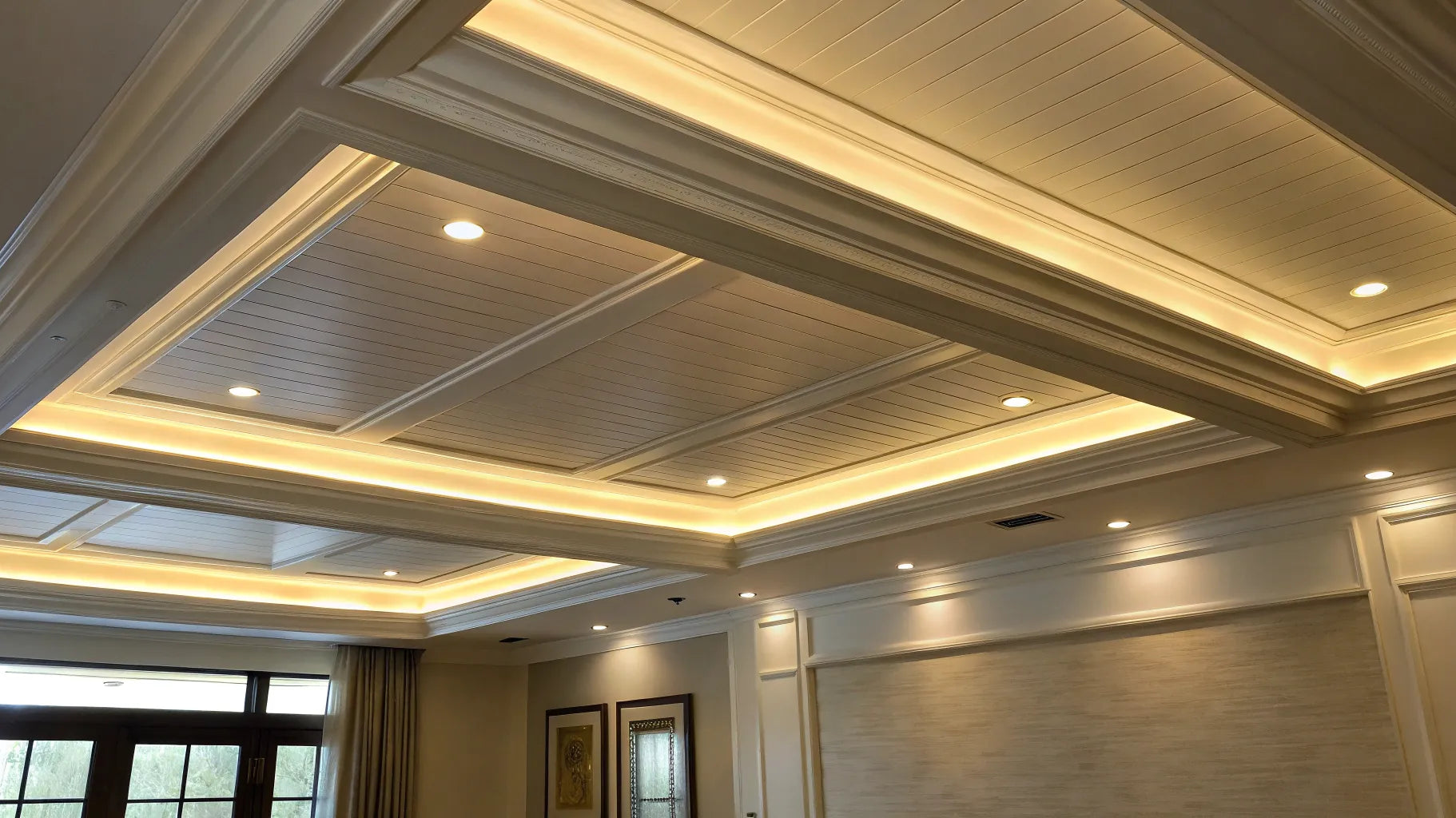 Recessed lighting in ceiling with vapor barrier.
