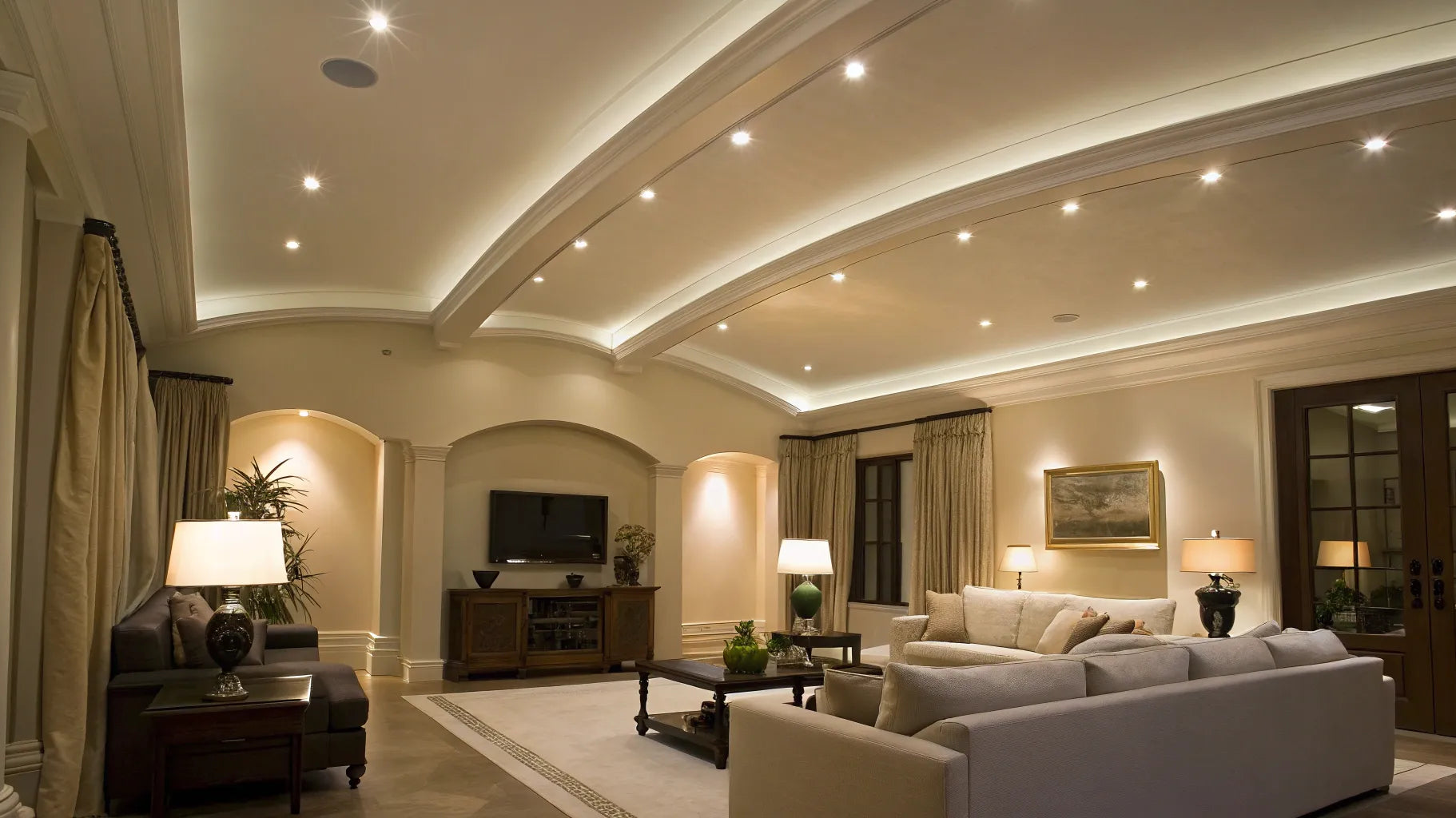Vaulted ceiling with recessed can lights.