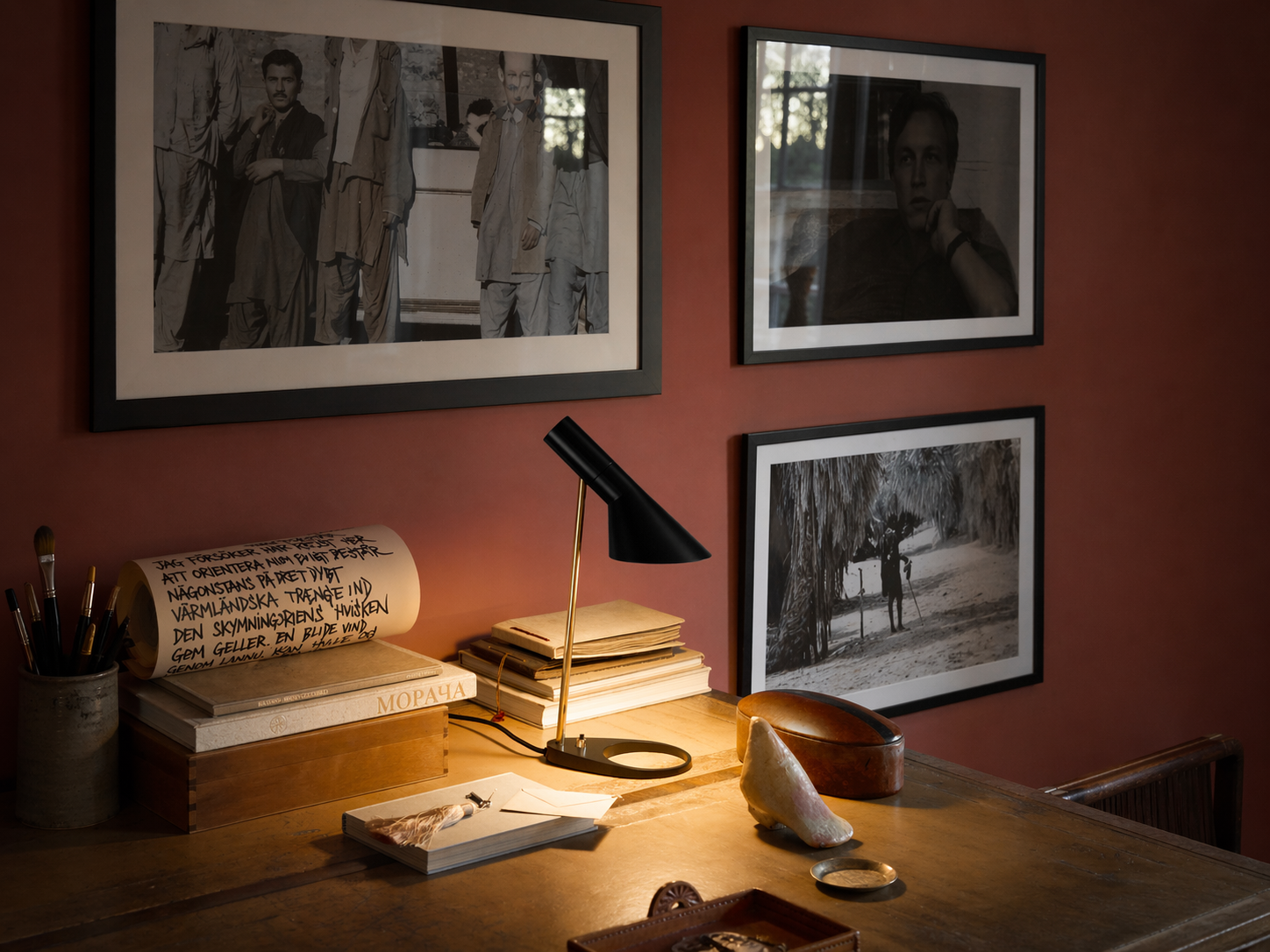 Desk lamp from Louis Poulsen Collection lighting a work table