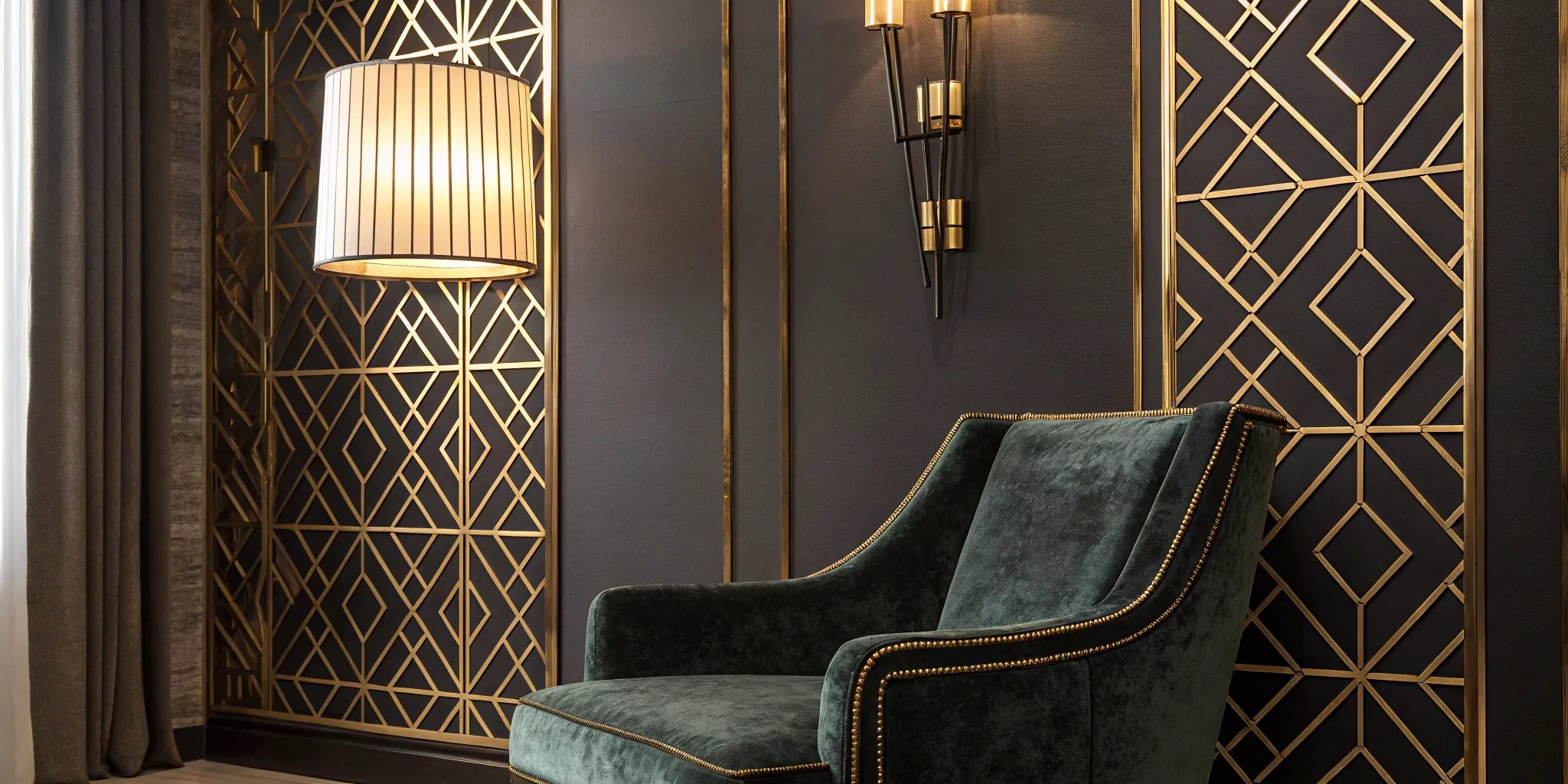 Art Deco wall sconce with geometric gold pattern.