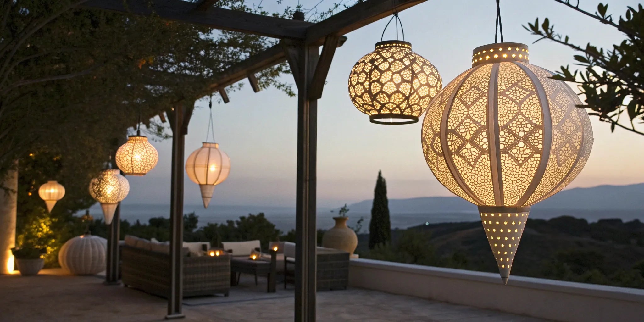 Paper lanterns hanging from a pergola at dusk.
