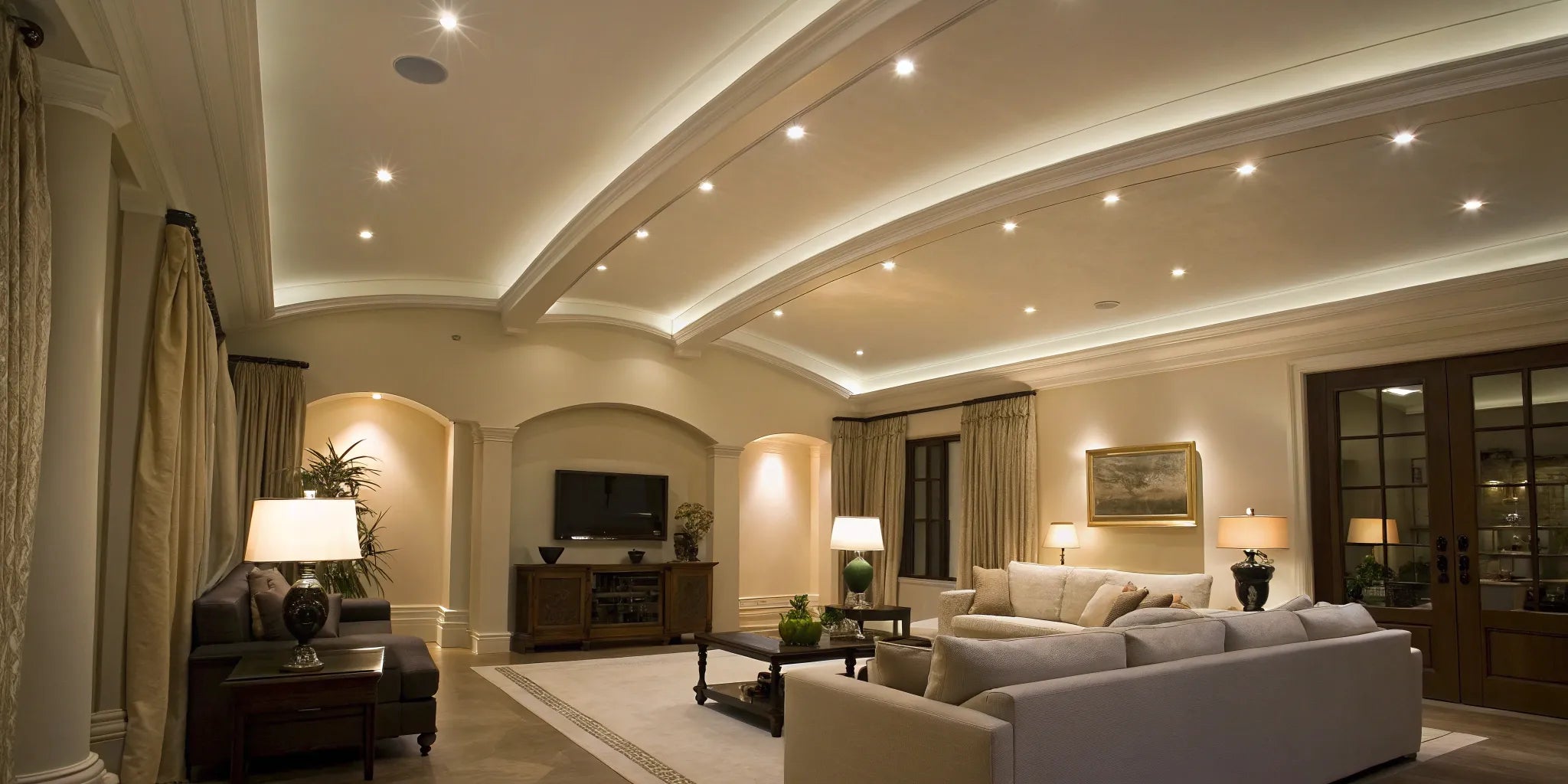 Vaulted ceiling with recessed can lights.
